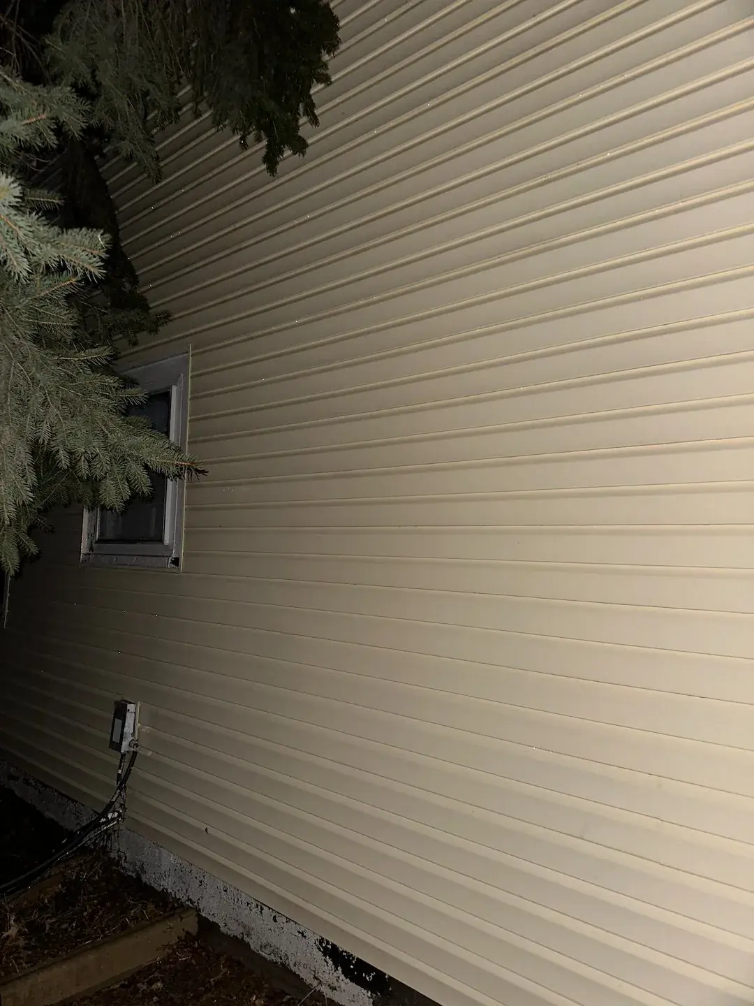 Clean siding beside a window